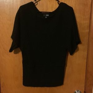 Cute black sweater with glitter specks.